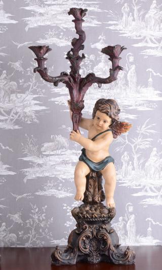 niezwykły kandelabr z barokową figurką puto